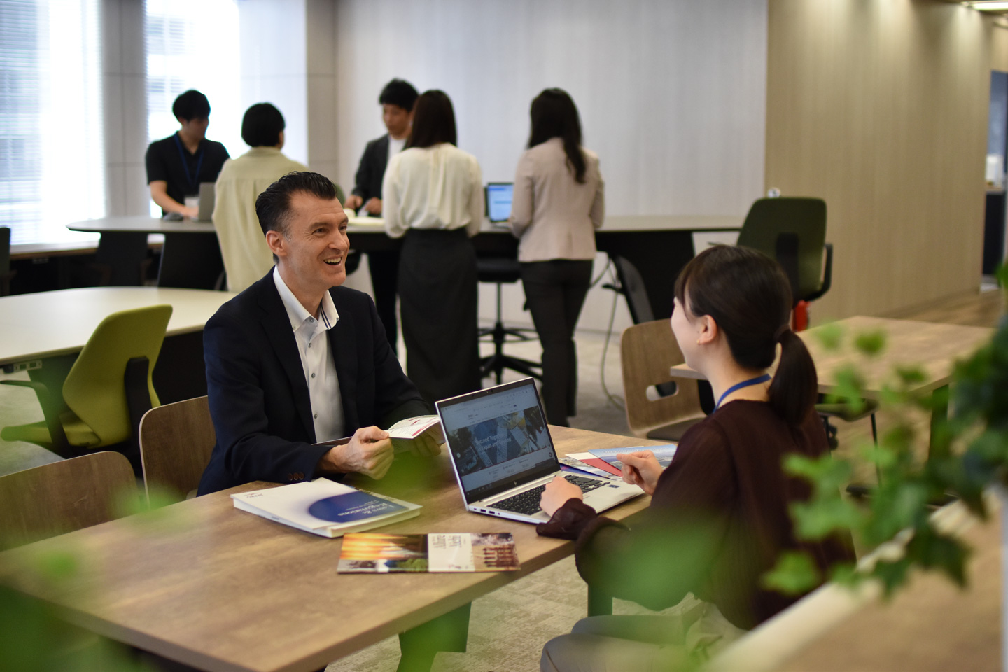 Business meeting atmosphere at the JETRO Invest Japan Business Support Center.